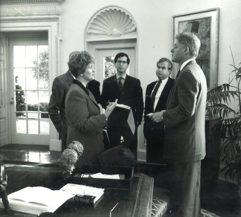 Swanee Hunt briefing President Bill Clinton in the Oval Office.
