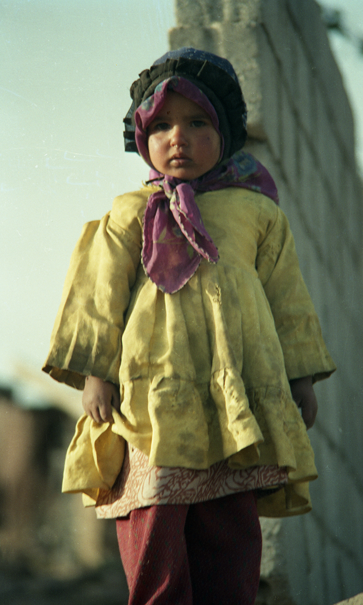 Yemeni girl in a yellow dress.